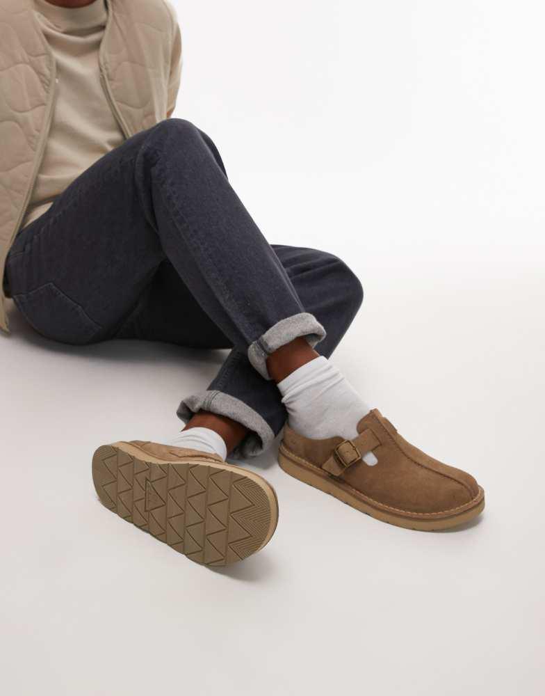 Shop Clarks Solsbury mule in cola brown suede on Sale at