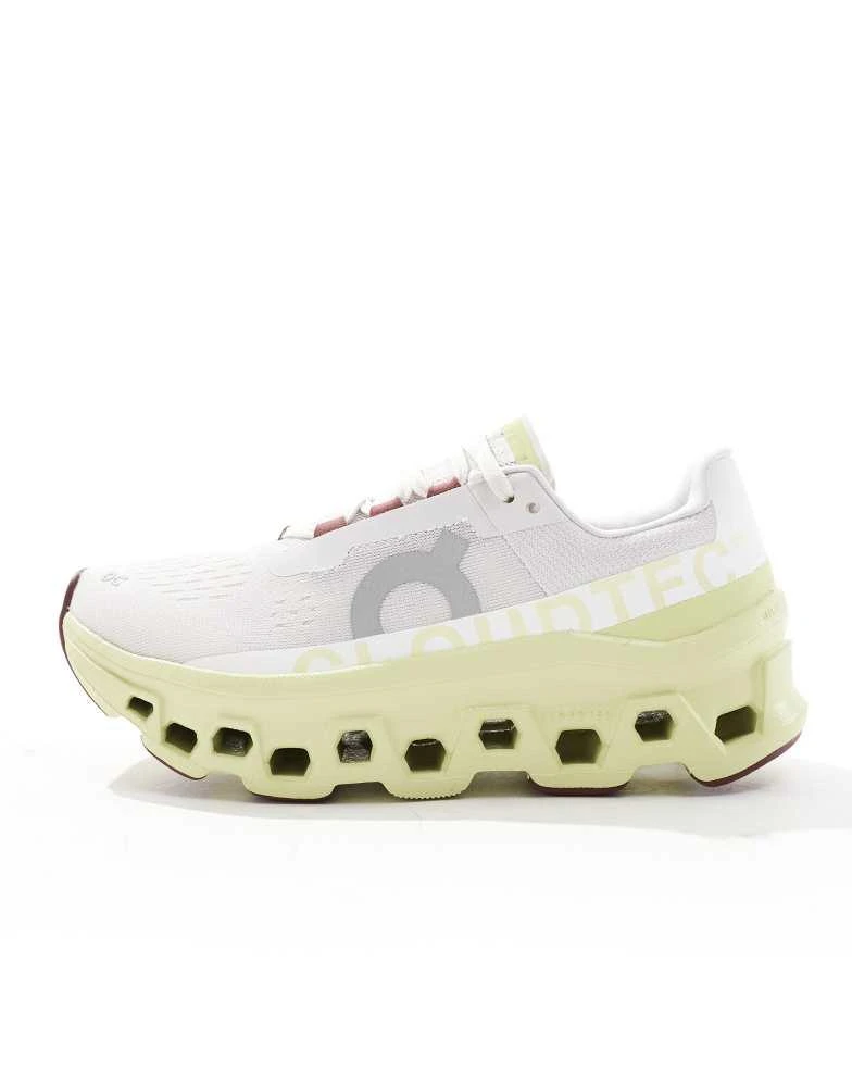 On ON Cloudmonster running trainers in white and yellow 3