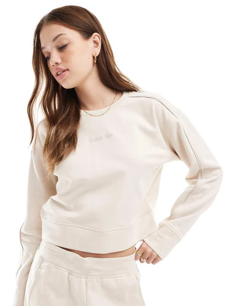 Calvin Klein Calvin Klein Tonal Logo lounge crew neck sweatshirt in cream 1