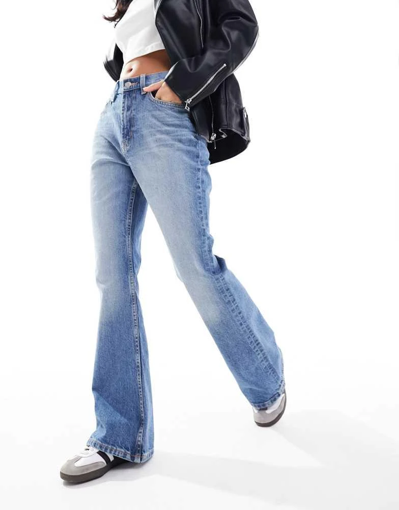 ASOS ASOS DESIGN Petite mid rise flare jeans in mid blue 4