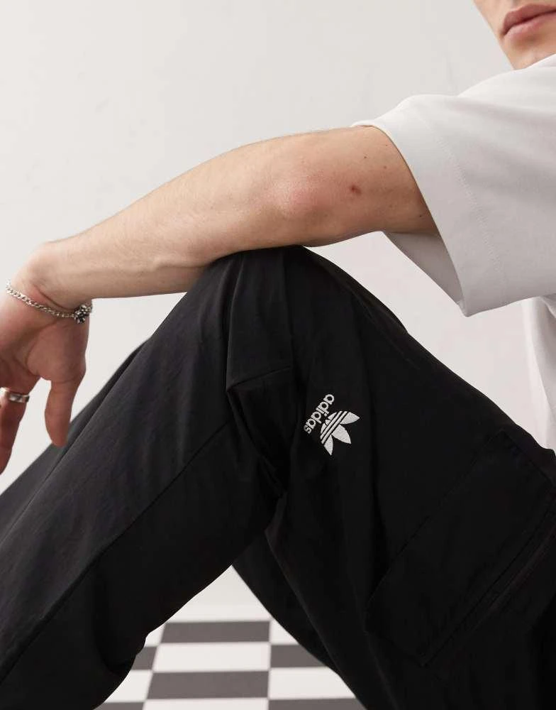 Adidas adidas Originals Trefoil Essentials Woven Cargo Pants in black 3