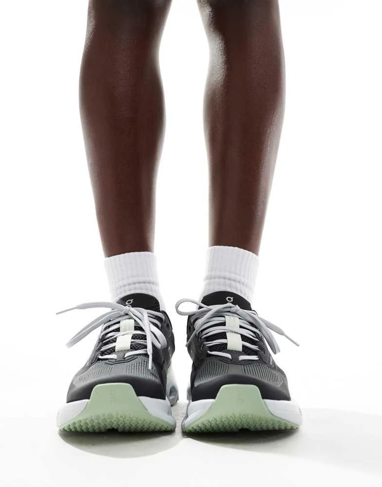 On ON Cloudrunner 2 running trainers in black and lime green 3