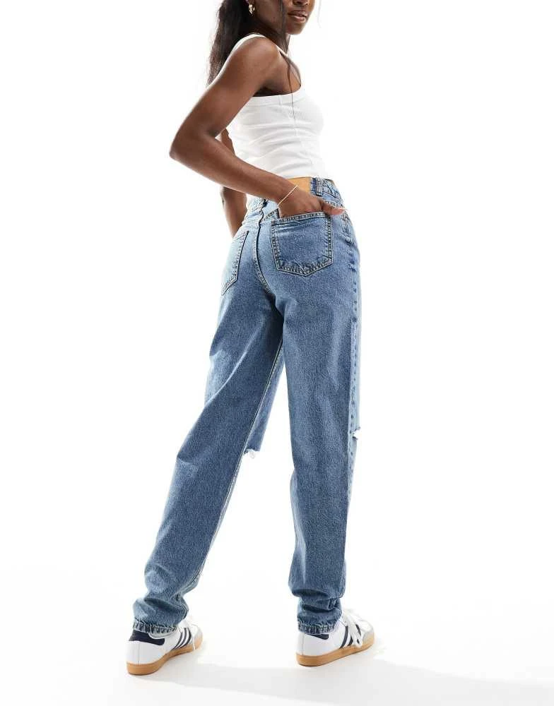 ASOS ASOS DESIGN high rise relaxed mom jeans with rips in mid blue 3