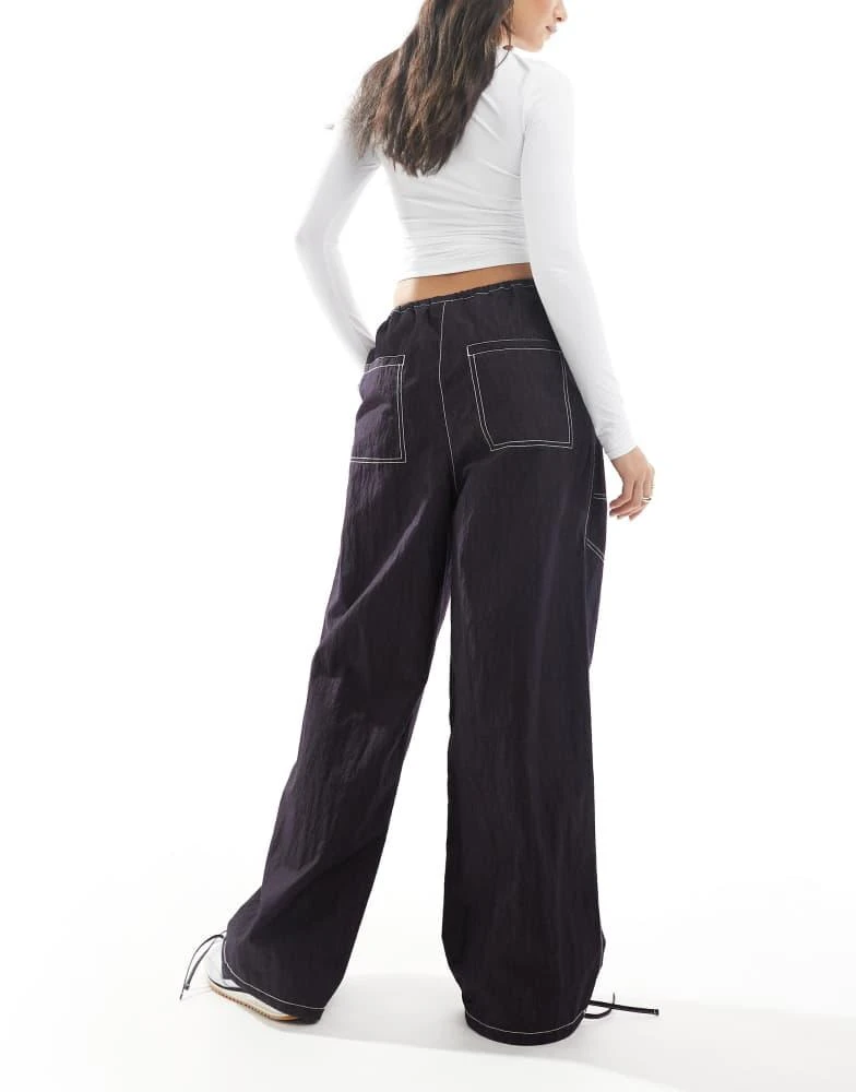 ASOS ASOS DESIGN wide leg trouser with tie hem and pocket detail in navy crinkle 4
