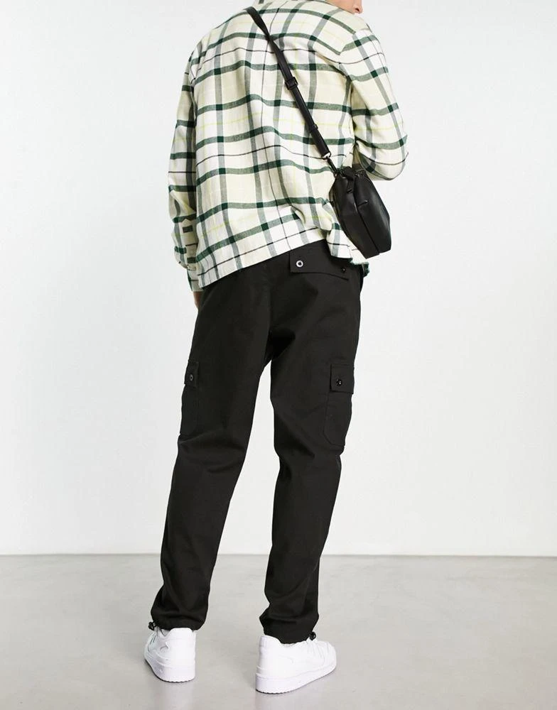 ASOS ASOS DESIGN tapered cargo trousers with toggles in black 2
