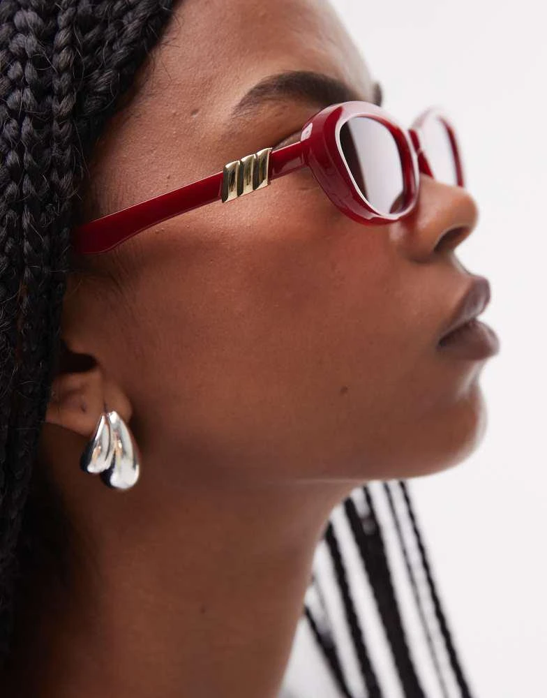 Le Specs Le Specs the whisperer oval sunglasses in garnet red 3