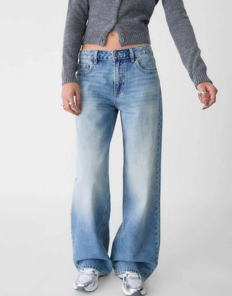 Shop Stradivarius low waist baggy jeans in washed blue on Sale at