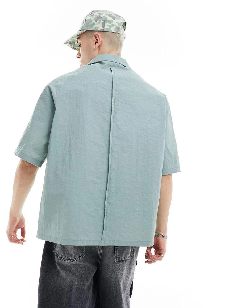 COLLUSION COLLUSION techy short sleeve revere shirt with raw seam detail in blue 4
