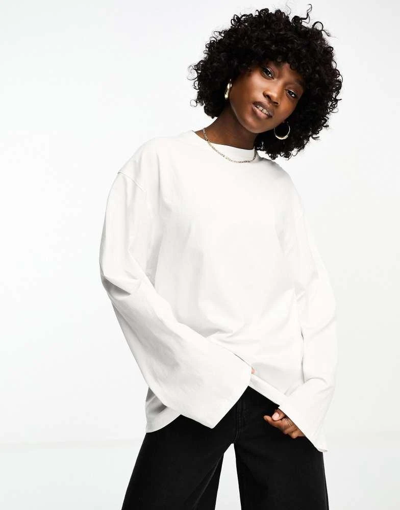 Weekday Weekday oversized long sleeve top in white 1