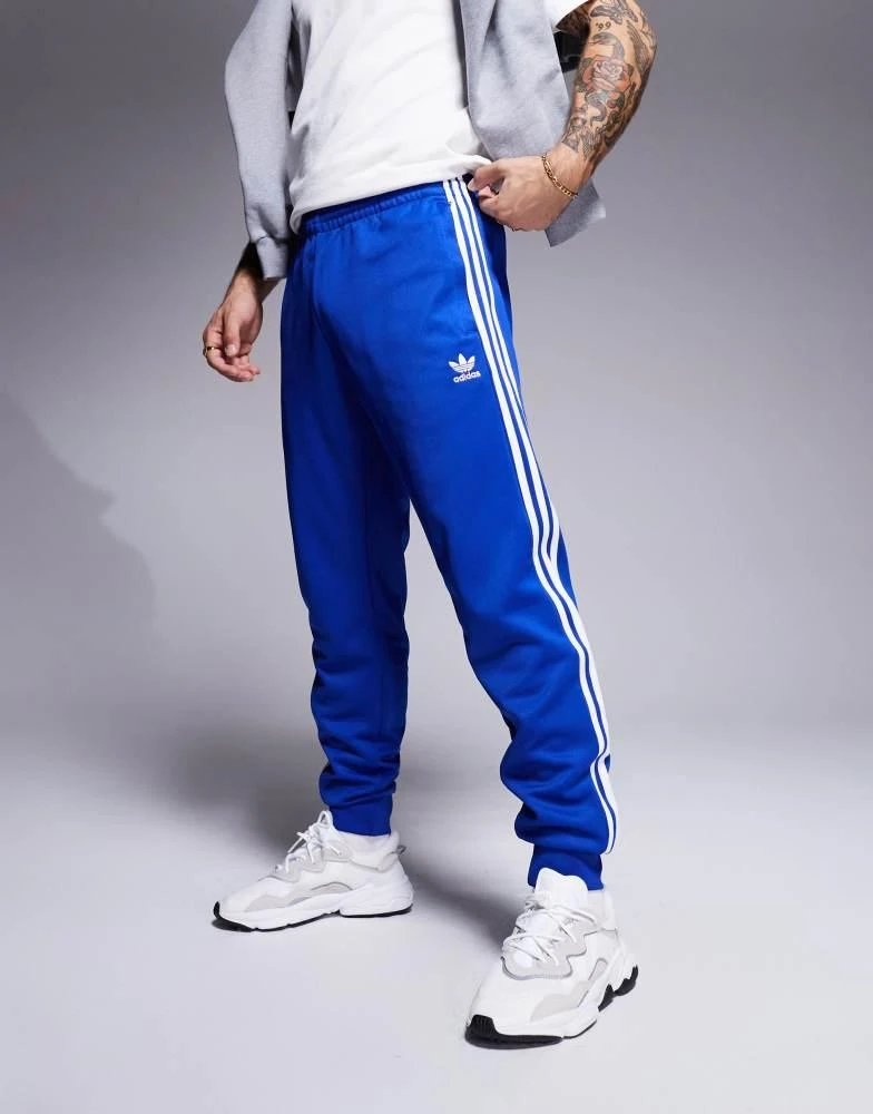 Adidas adidas Originals skinny jogger in blue 1