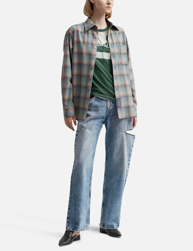 MAISON MARGIELA Denim jeans with slash details 4