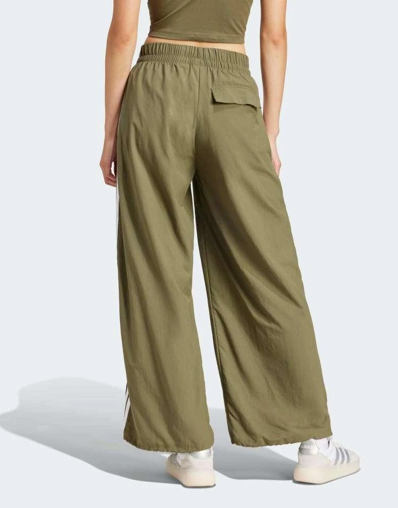 Adidas adidas Performance essentials 3-stripes lifestyle woven parachute pants in green 2