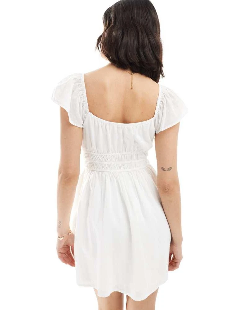 white backless skater dress Chic Sensation Low Back Crepe Skater Dress