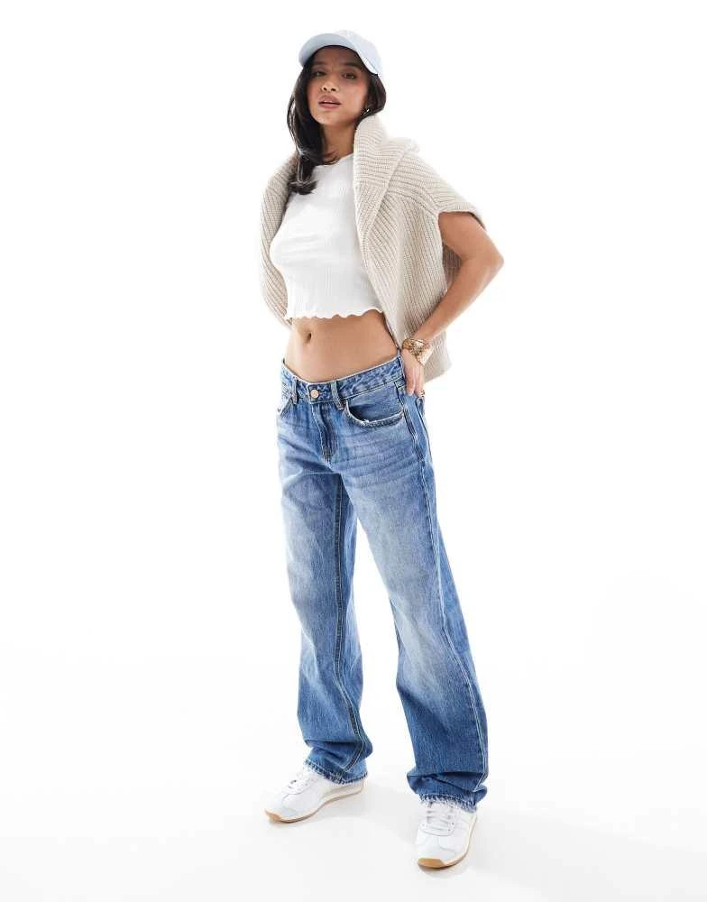 Stradivarius Stradivarius Petite D03 low waisted straight leg jean in mid blue wash 1