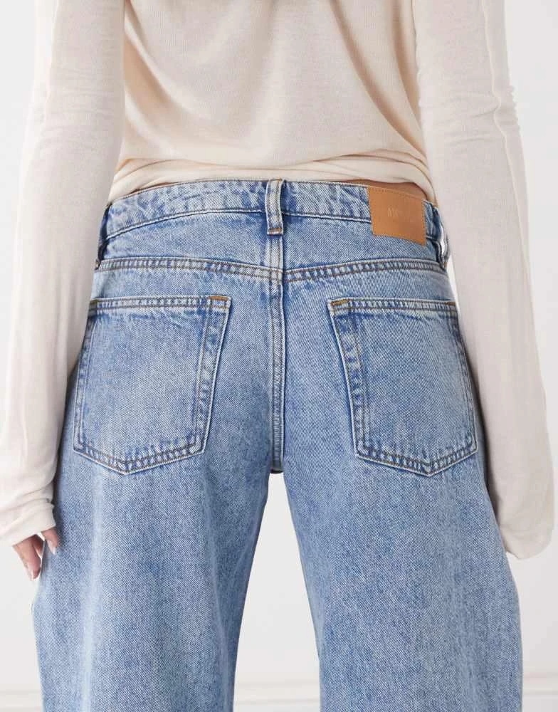 Monki Monki Imoo low waist wide leg jeans with cut out bow details in light blue wash 4
