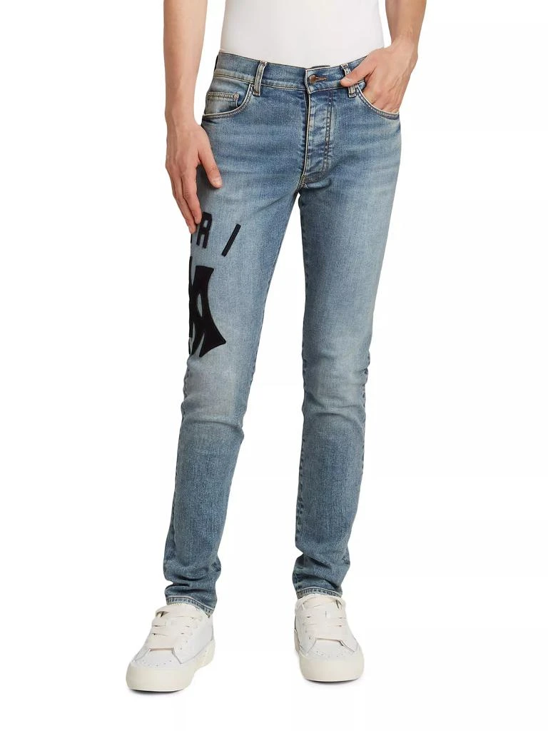 AMIRI Suede Appliqué Logo Skinny Jeans 3