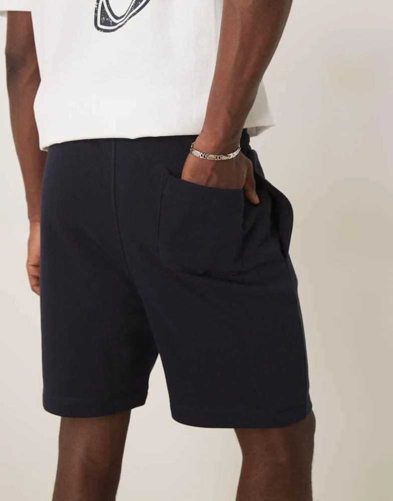 ASOS ASOS DESIGN essential mid length slim shorts in navy 2
