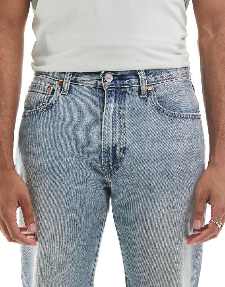 Shop Levi's 567 relaxed flare jeans in light wash on Sale at