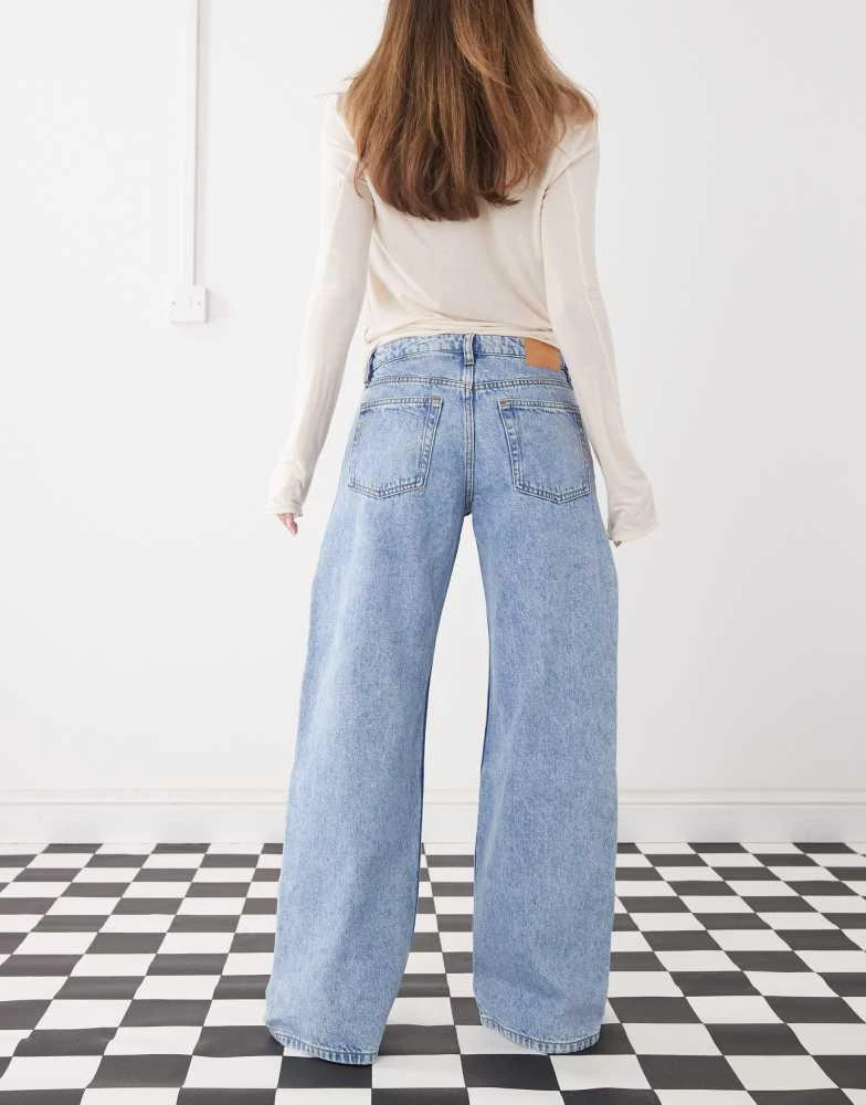 Monki Monki Imoo low waist wide leg jeans with cut out bow details in light blue wash 2