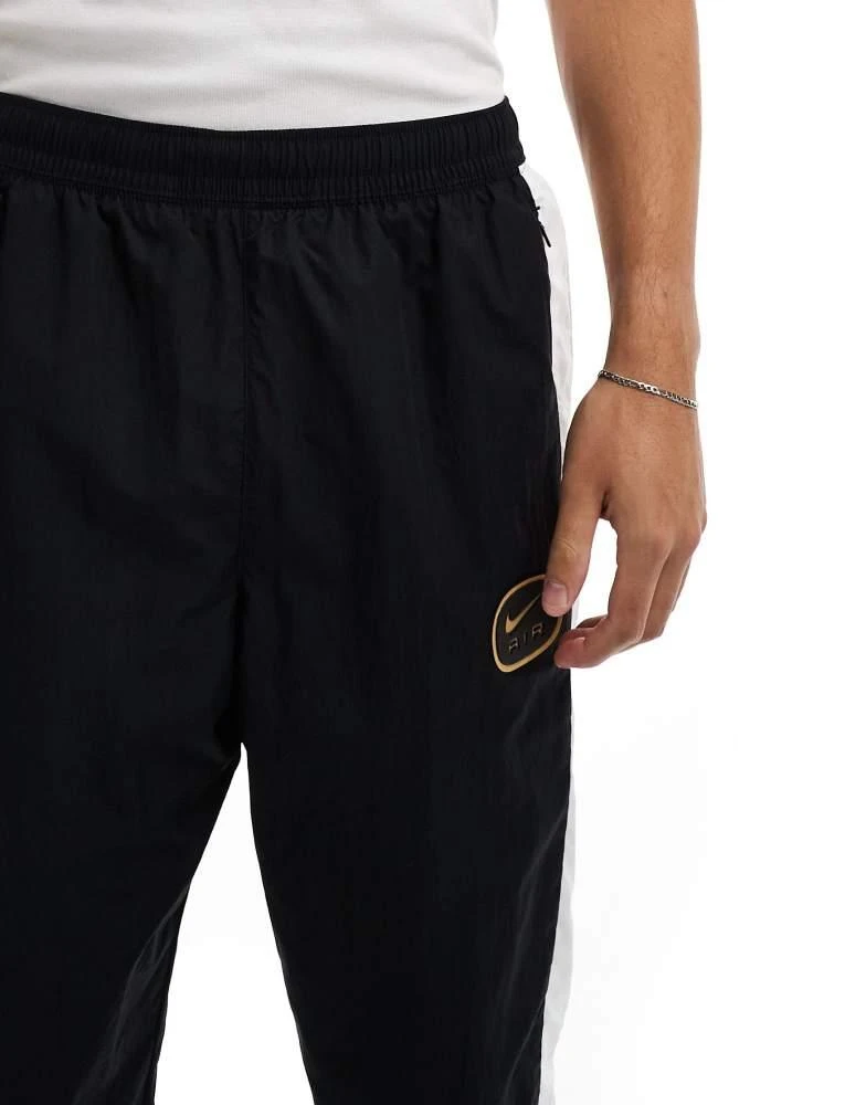 NIKE Nike Swoosh Air woven joggers in black and white 5