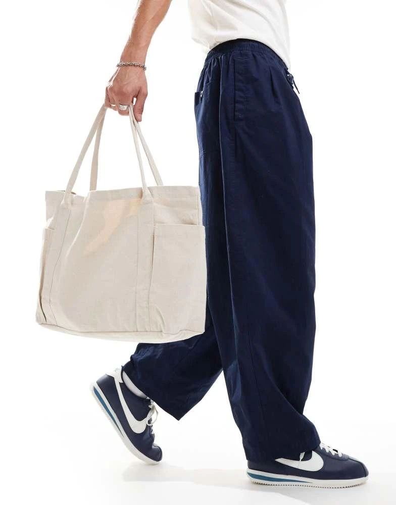 NIKE Nike Club woven balloon oversized trousers in navy 3