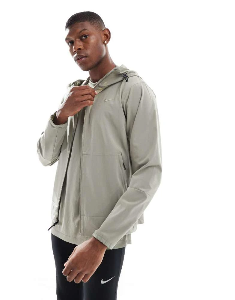 NIKE Nike Training Dri-FIT jacket in light khaki 1
