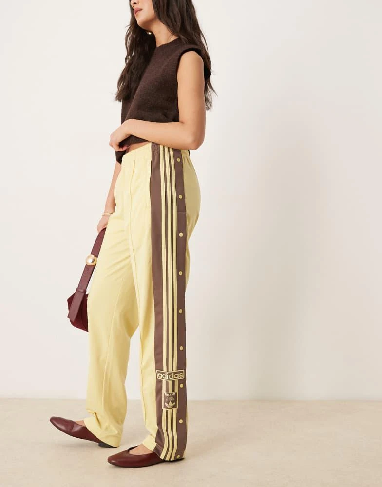 Adidas adidas Originals Adibreak track pants in yellow and brown 1