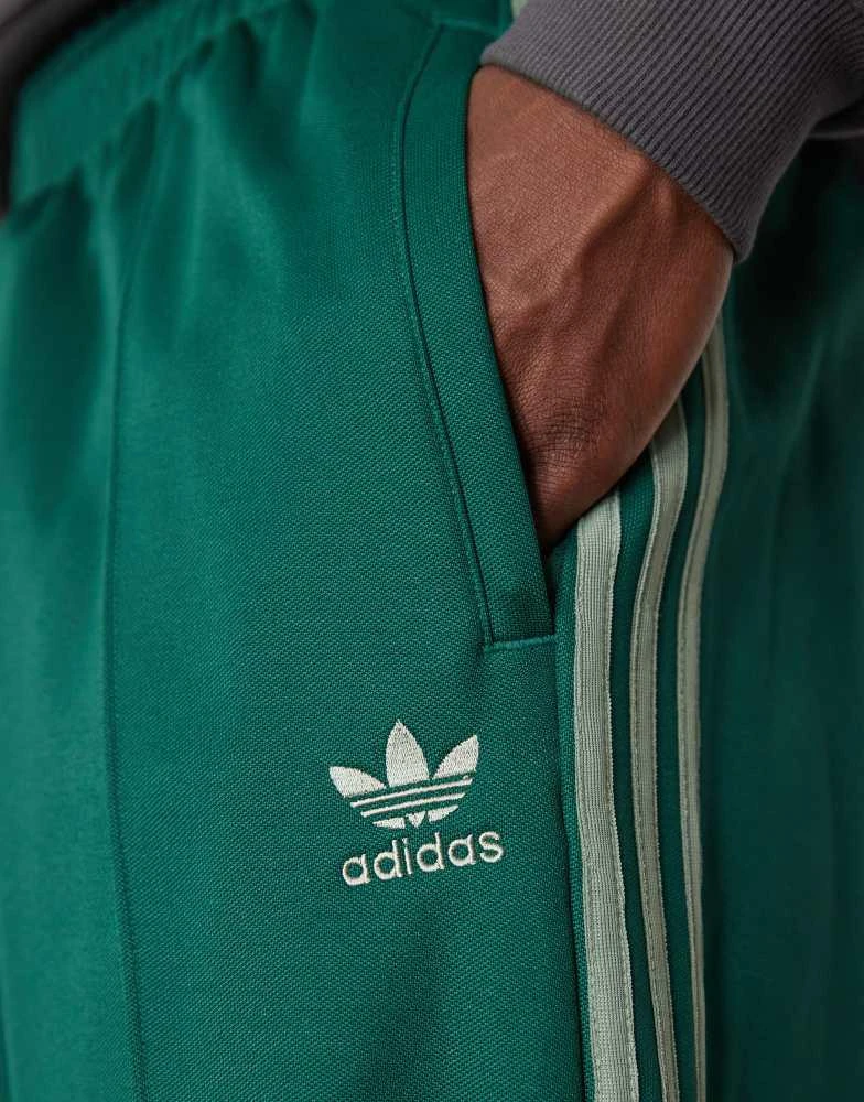 Adidas adidas Originals Firebird Loose track pants in green 4
