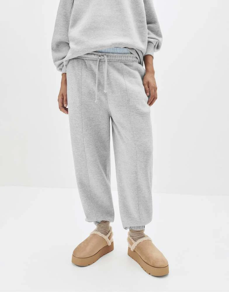 Pull&Bear Pull&Bear Seam detail tracksuit bottoms in grey marl 1