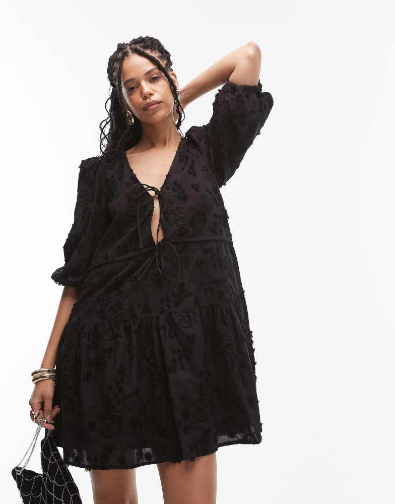 & Other Stories & Other Stories embroidered mini dress with front tie detail and tiered hem in black 1