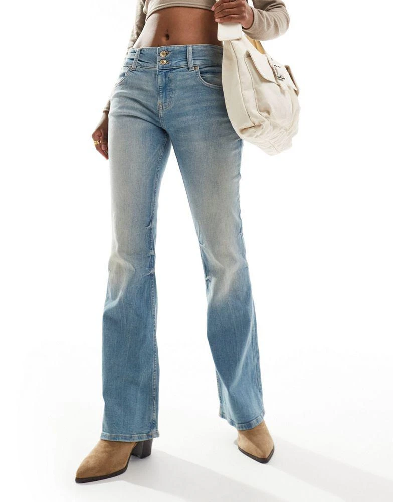 Bershka Bershka low rise bootcut jeans in light blue dirty wash 1