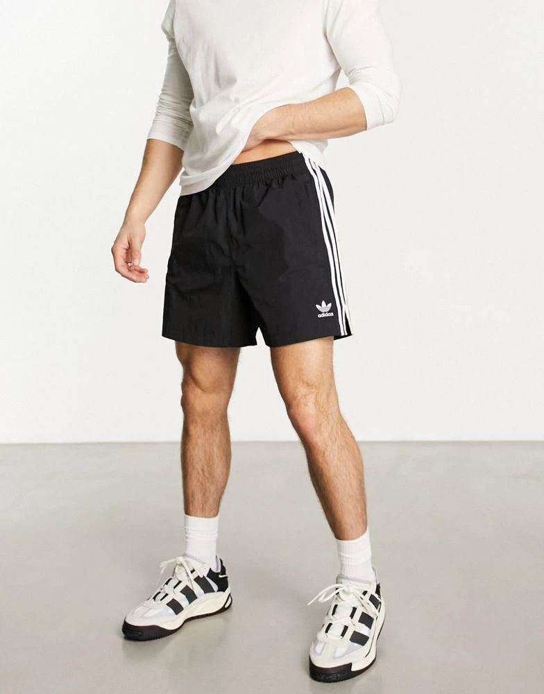 Adidas adidas Originals 3 stripe sprinter shorts in black 1