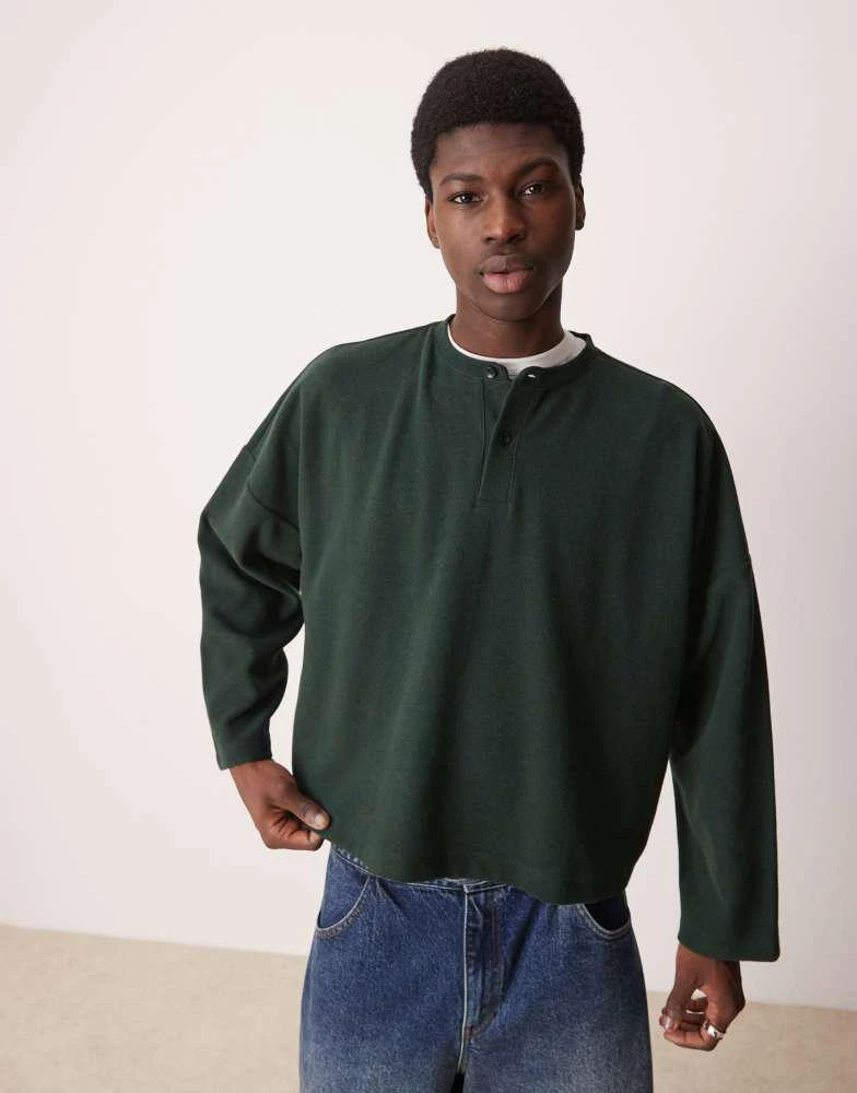 ASOS ASOS DESIGN super oversized cropped heavyweight rib henley jumper in dark green 1