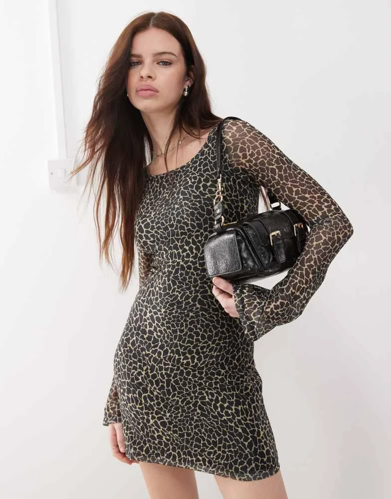 Motel Motel sartika flared sleeve giraffe print mini dress in black and cream 1