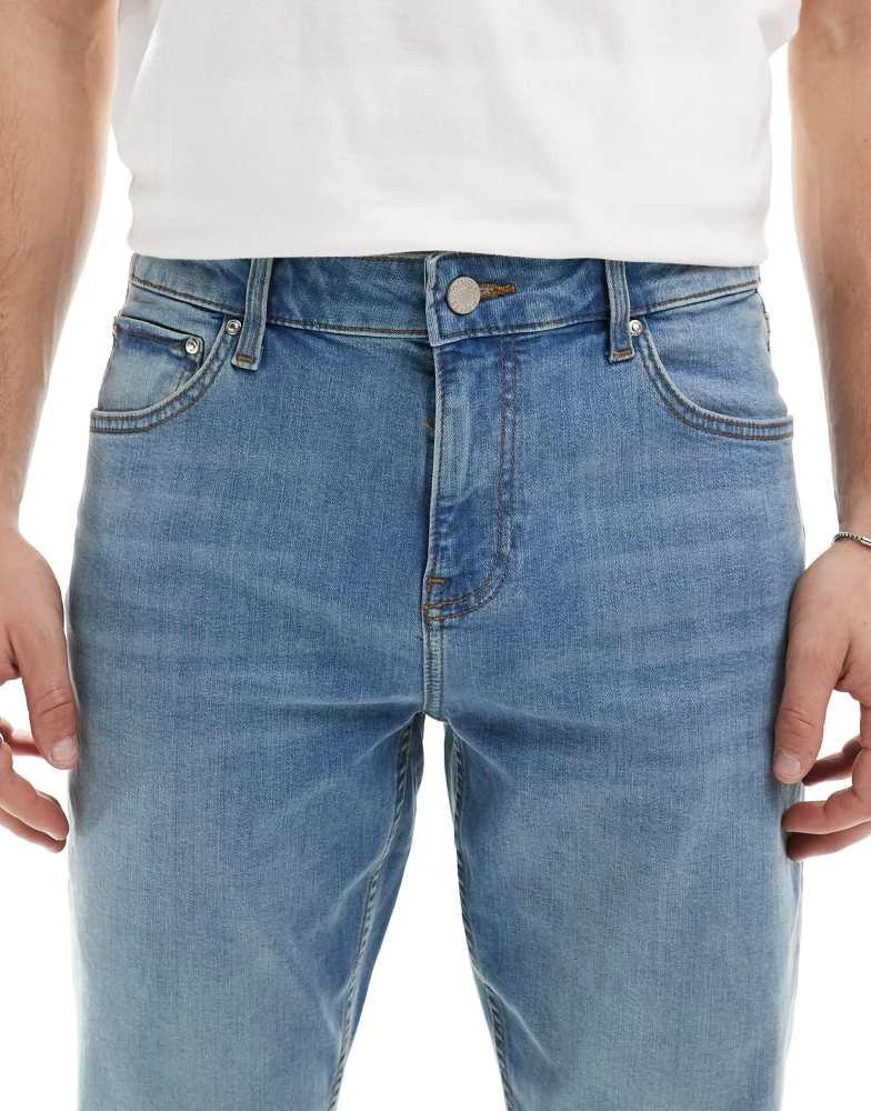 ASOS ASOS DESIGN skinny jeans with yellow tint in mid wash blue 5