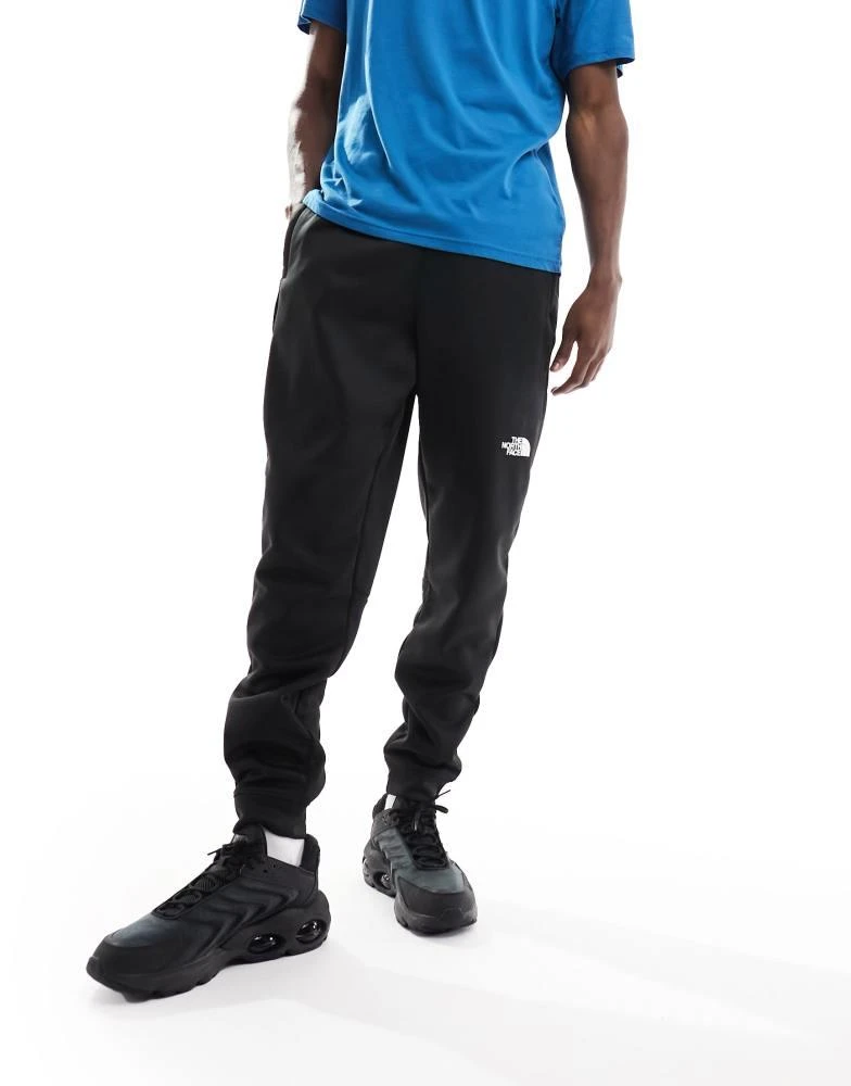 The North Face The North Face Training Reaxion fleece joggers in black 1
