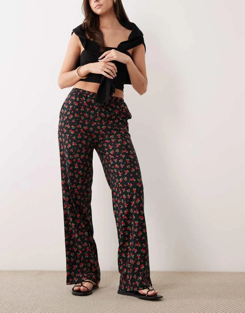 Threadbare Threadbare jersey pull on trouser with drawstring in black with red floral print