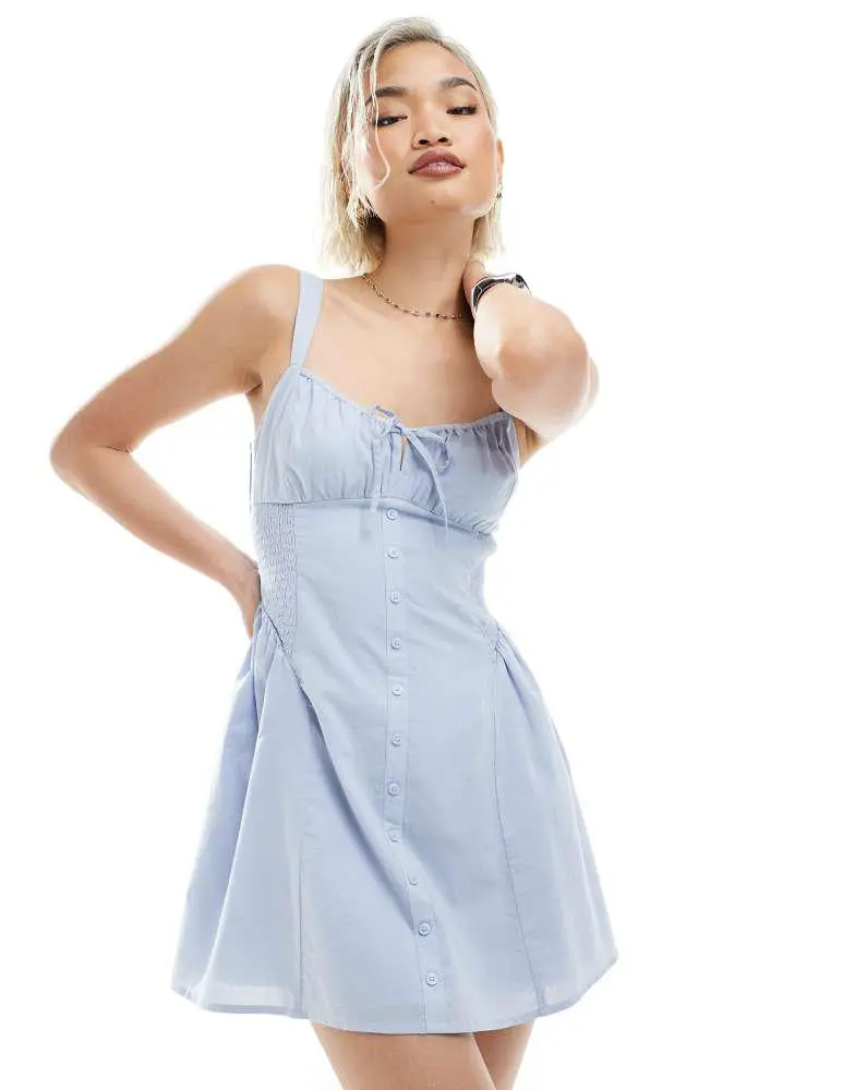 Hollister milkmaid dropped waist button detail sleeveless mini dress in dusty blue Hollister milkmaid dropped waist button detail sleeveless mini dress in dusty blue