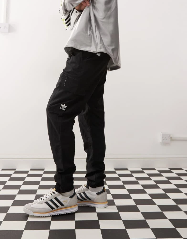 Adidas adidas Originals Trefoil Essentials Woven Cargo Pants in black 1