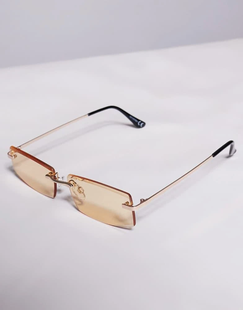 ASOS ASOS DESIGN rectangle rimless sunglasses with yellow lens and gold temples 2