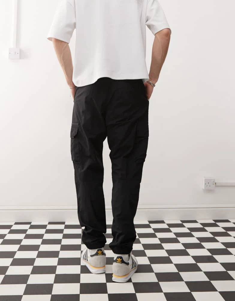Adidas adidas Originals Trefoil Essentials Woven Cargo Pants in black 4