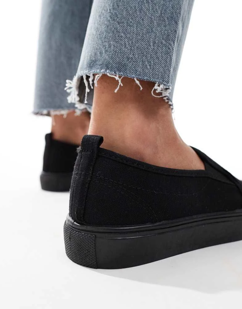 ASOS ASOS DESIGN Wide Fit Dotty slip on plimsolls in black 3