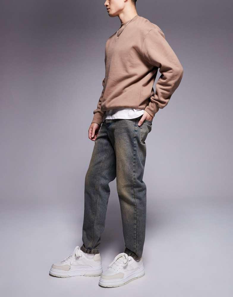 ASOS ASOS DESIGN tapered fit jean in light wash with tint