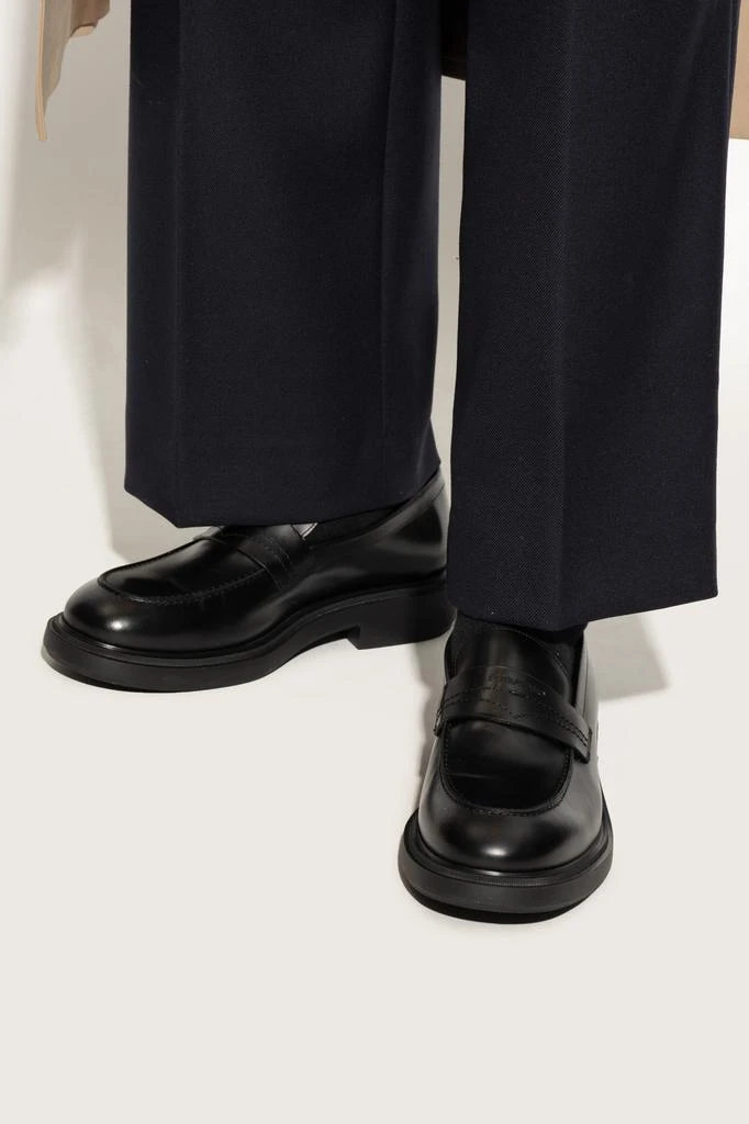 NEW SALVATORE FERRAGAMO men\'s caligola logo embossed slip-on loafers in black Shop Shoes Caligola type loafers on Sale at BeyondStyle  main image 3