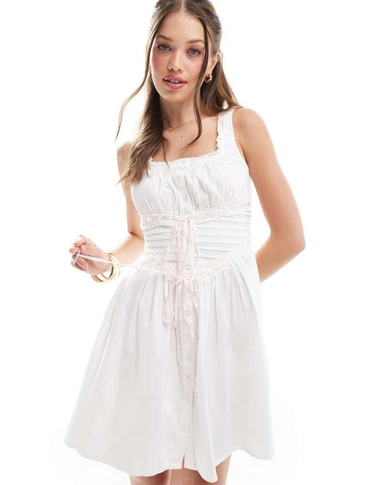ASOS ASOS DESIGN pintuck mini prairie dress with ribbon trim in white 2