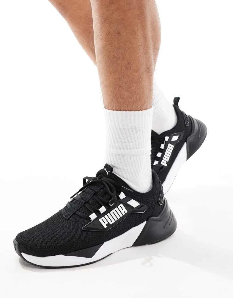 Puma Puma Retaliate 3 trainers in black & white 1