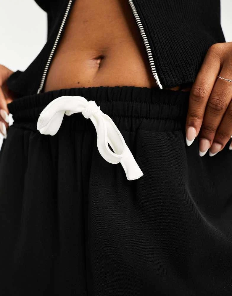 ASOS ASOS DESIGN pull on trousers with contrast panel in black 2