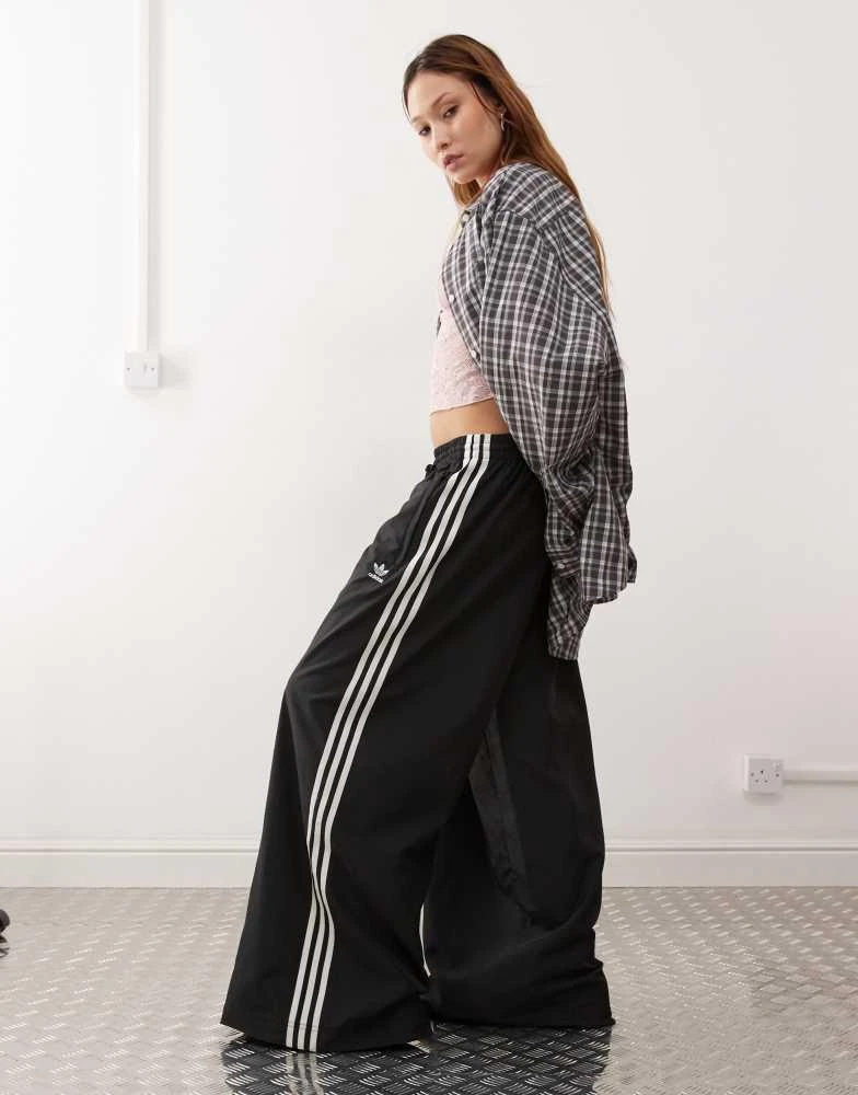 Adidas adidas Originals Adicolor wide leg track pants in black 1