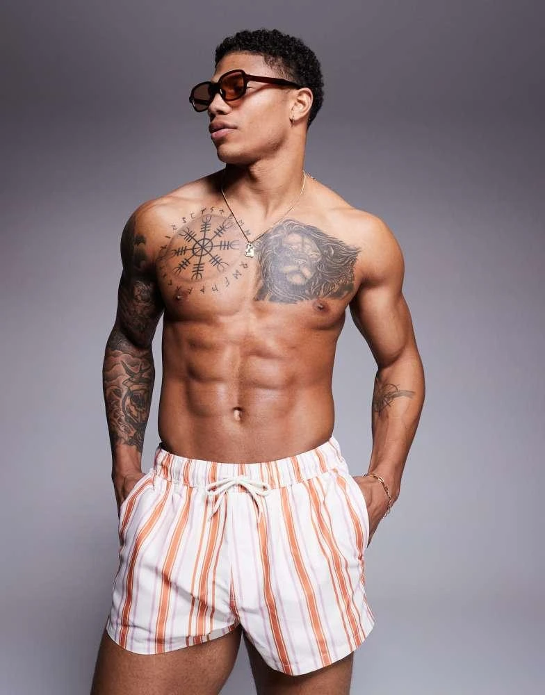 ASOS ASOS DESIGN swim short in super short length in white and orange stripe 1