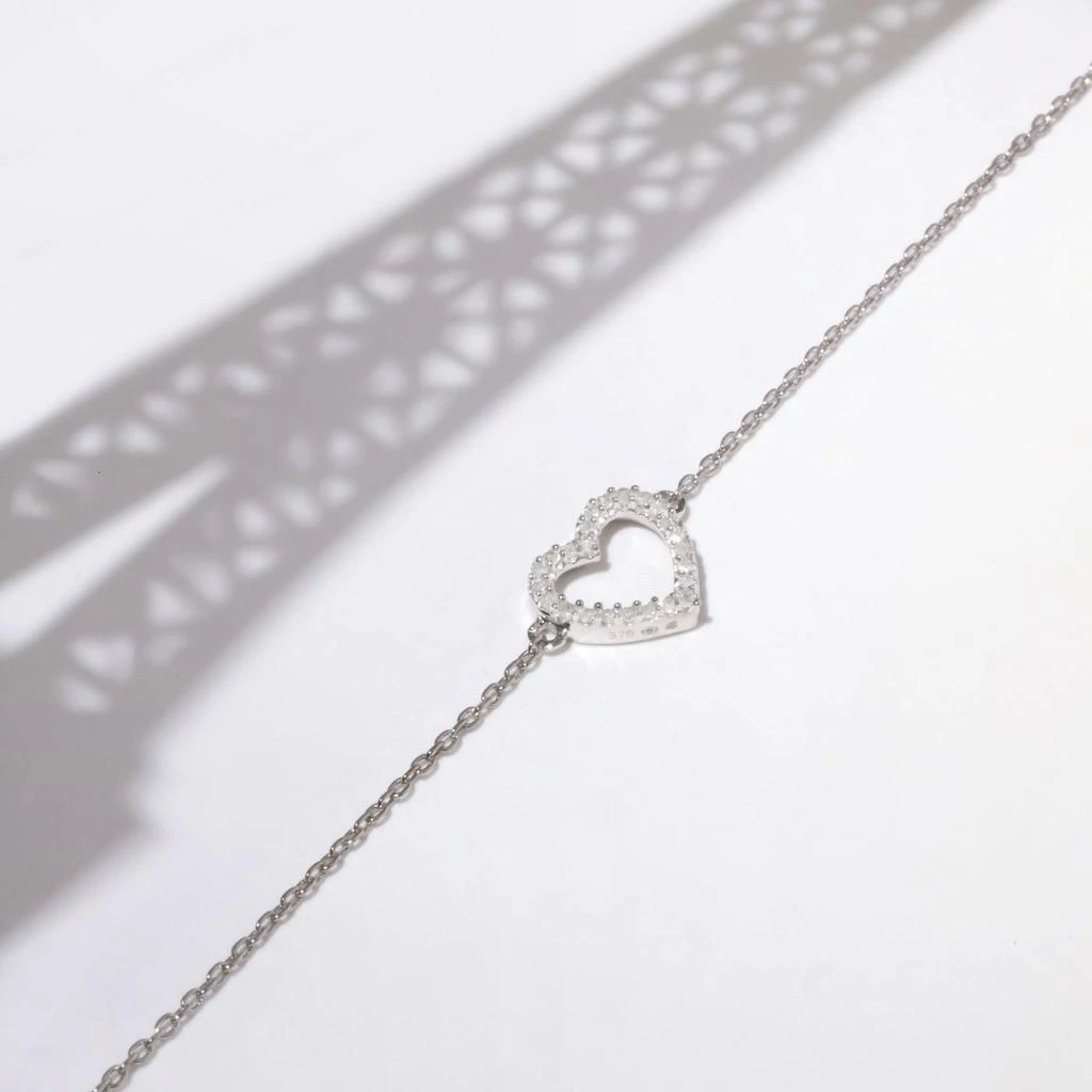 Diamond 
Co Bracelet "Tu Portes Mon Coeur" D0,05/24 - Or Blanc 375/1000